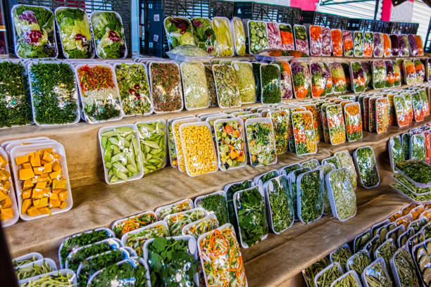 packaged vegetables and veggies at a free street fair in brazil - packaged food imagens e fotografias de stock