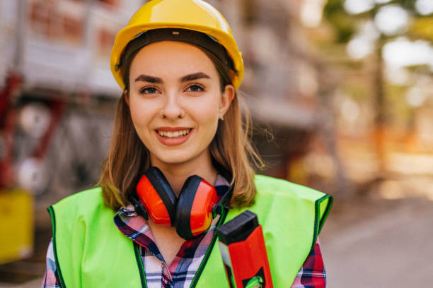 istock Blue-collar woman working on the construction site 1140218232