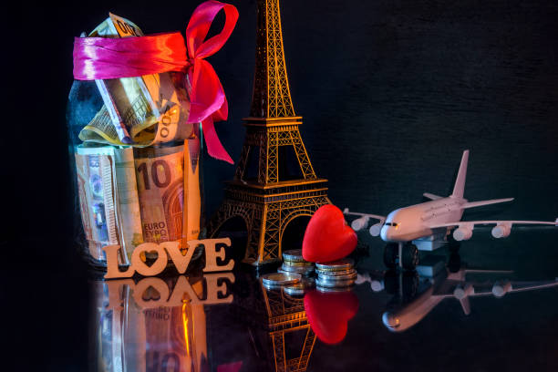 istock Savings for travel to Paris and toy eiffel tower 1140219214