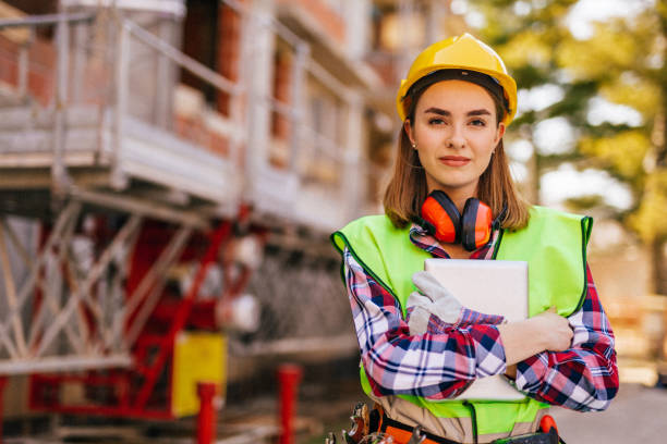 istock Blue-collar woman working on the construction site 1140219500