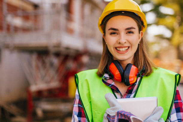 istock Blue-collar woman working on the construction site 1140219780