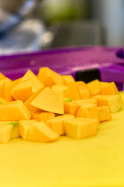 istock Cutted Pumpkin Pieces on the Yellow Plastic Board - Kitchen Set 1140220046