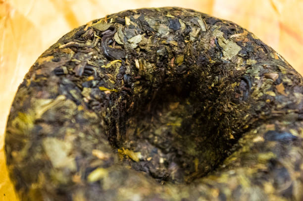 istock Chinese pressed puer tea on wrapping paper, close-up, macro 1140220201