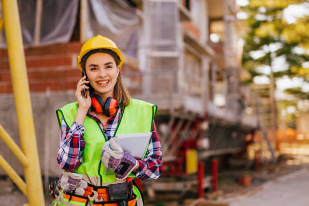 istock Blue-collar woman working on the construction site 1140220864