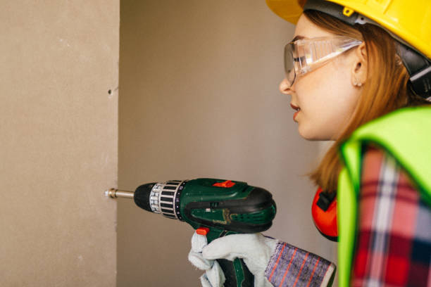 istock Blue-collar woman working on the construction site 1140220932