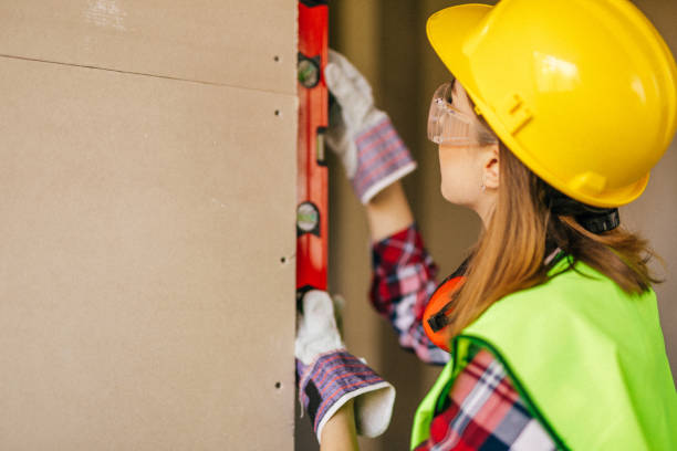 istock Blue-collar woman working on the construction site 1140220970