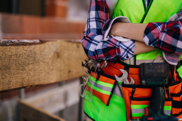 istock Blue-collar woman working on the construction site 1140221288