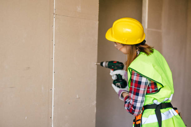 istock Blue-collar woman working on the construction site 1140221398