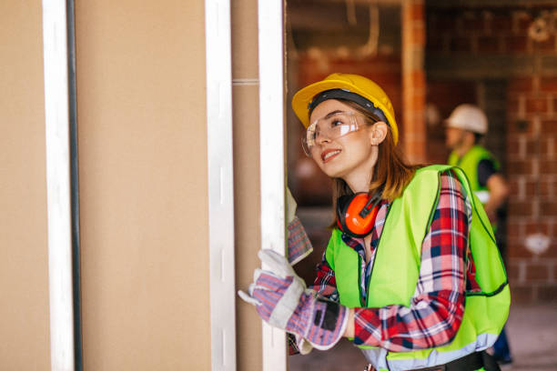 istock Blue-collar woman working on the construction site 1140221475