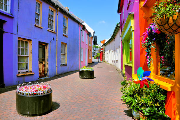 Vibrant colorful buildings in the Old Town of Kinsale, Cork, Ireland Quaint street lined with vibrant colorful buildings in the Old Town of Kinsale, County Cork, Ireland county cork stock pictures, royalty-free photos & images