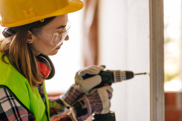 istock Blue-collar woman working on the construction site 1140222260