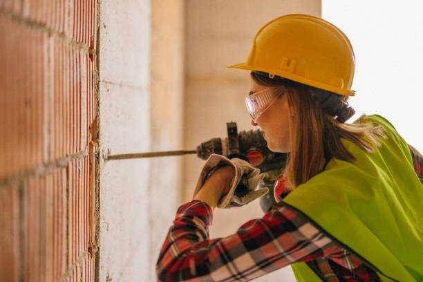 istock Blue-collar woman working on the construction site 1140222382
