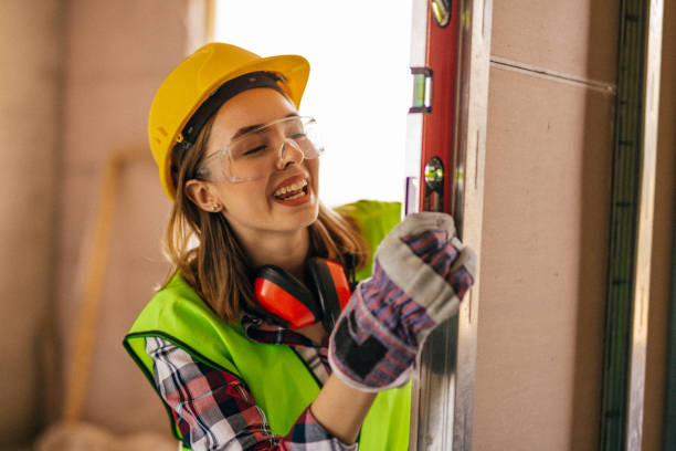 istock Blue-collar woman working on the construction site 1140222583