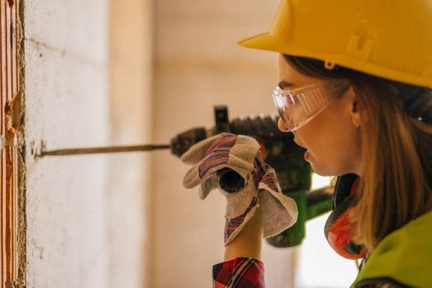 istock Blue-collar woman working on the construction site 1140222818