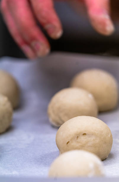 istock Small Bread Dough Balls Placed on Cooking Paper on Pan - Ready to be Baked, Kitchen Set 1140223840