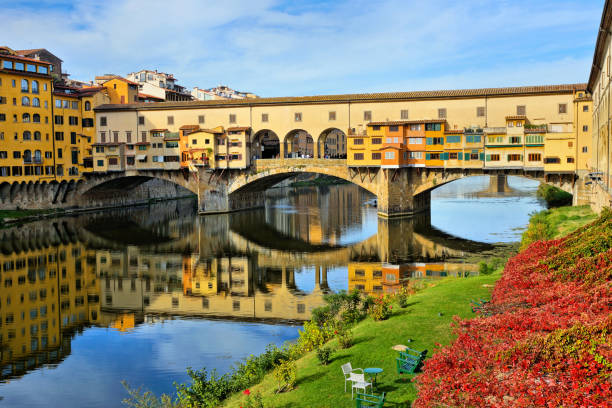 istock Medieval Ponte Vecchio with reflections during autumn, Florence, Tuscany, Italy 1140224222