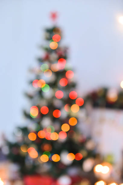 istock Christmas decor for table setting, bokeh of christmas tree, studio with a Christmas tree. out of focus 1140225348