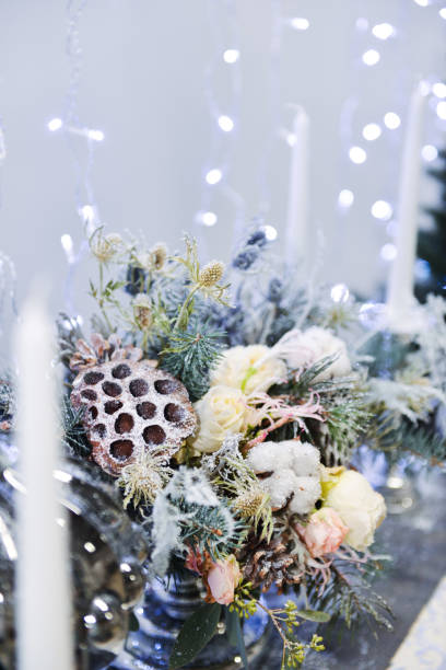 istock Christmas decor for table setting, or wedding decor, studio with a Christmas tree. Christmas decorations toys, candles, fir branches 1140225365