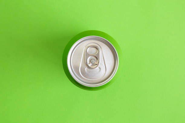 istock Top view of drink can isolated on green. 1140226525