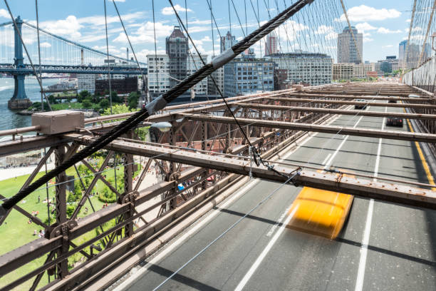 istock Yellow cab speeding on Brooklyn Bridge 1140242448