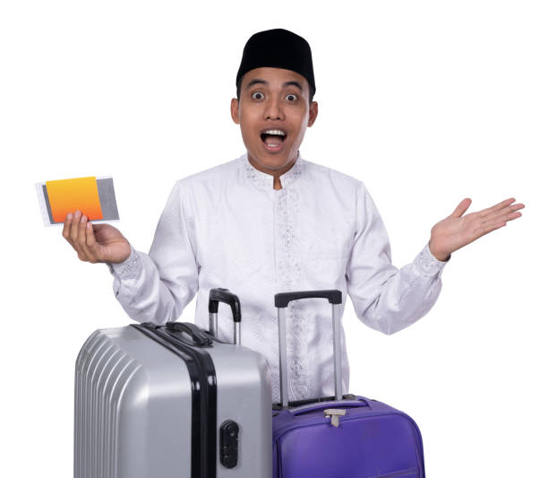 istock muslim male with suitcase surprised 1140242637