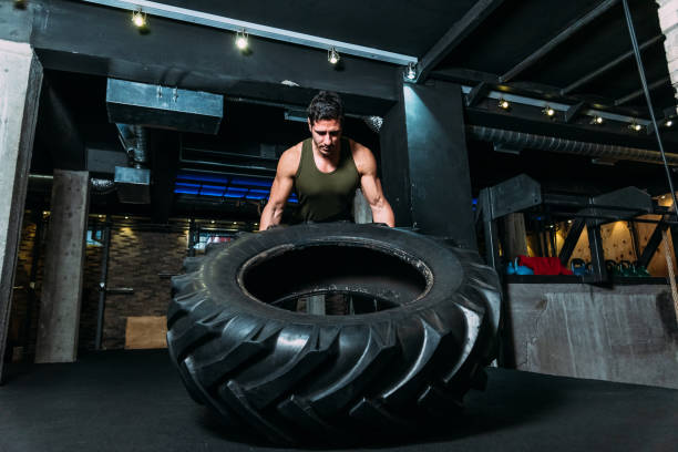 istock Cross Training with tire at gym 1140244298