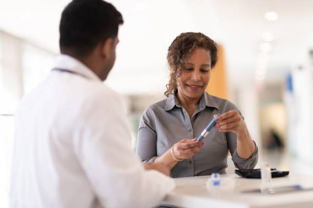 istock Male doctor teaching his senior patient 1140250437
