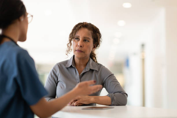 istock Female doctor talking with her senior patient 1140250441