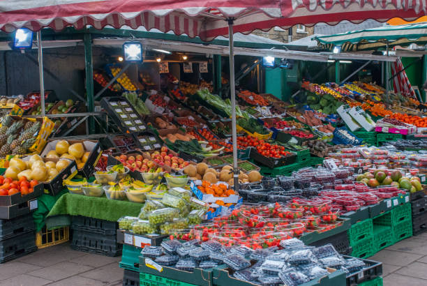 istock Fruit shop next to the street walkway 1140250928