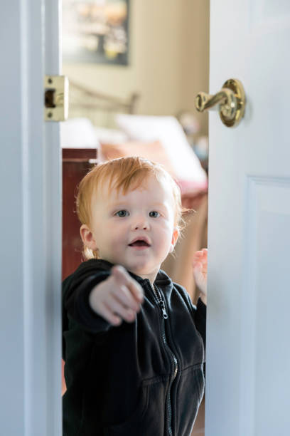 istock Baby Learning to Open a Door 1140254882