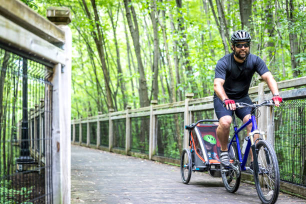 Millennial Father Biking with Toddler