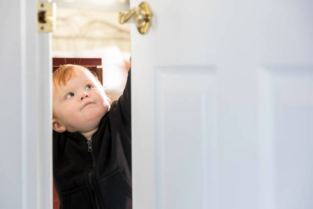 istock Baby Learning to Open a Door 1140255020
