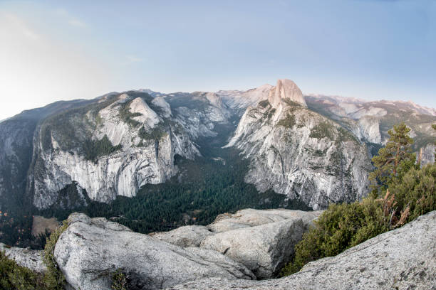 Geological features of Yosemite Valley seen from top of Glacier Point. Half dome after sunset.
