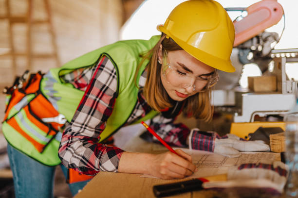 istock Blue-collar woman working on the construction site 1140255766