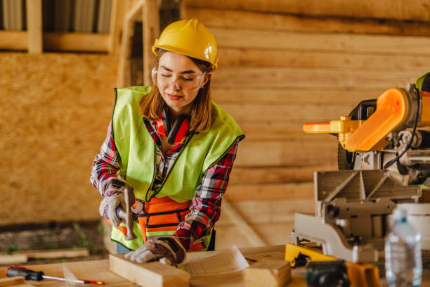 istock Blue-collar woman working on the construction site 1140255827