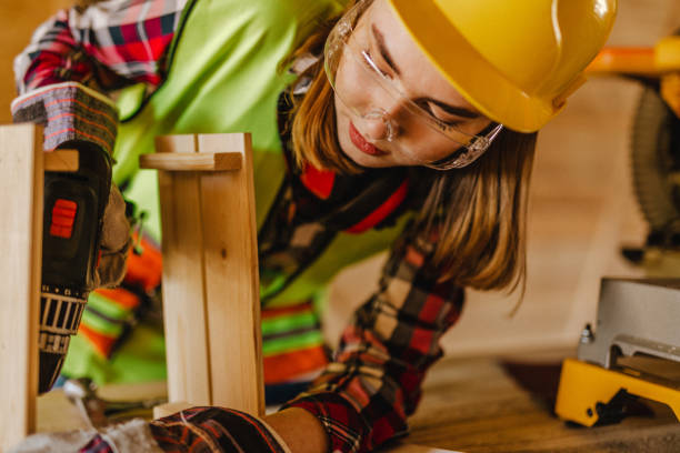istock Blue-collar woman working on the construction site 1140257175