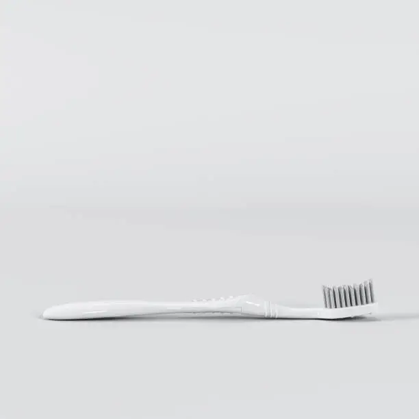 Photo of Outstanding white toothbrush on white background. All white minimal concept.