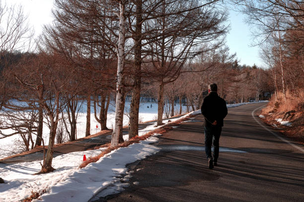 istock A man walking down a countryside road in the Winter 1140260100