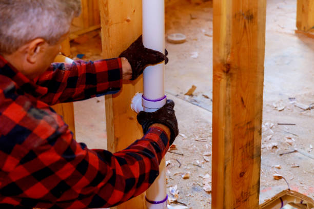 istock Plumber Installing PVC Pipe at under construction of the house 1140262555