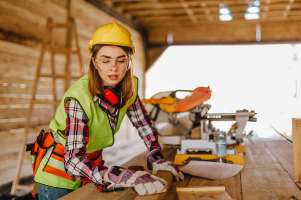 istock Blue-collar woman working on the construction site 1140263977