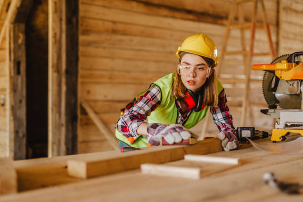 istock Blue-collar woman working on the construction site 1140264013