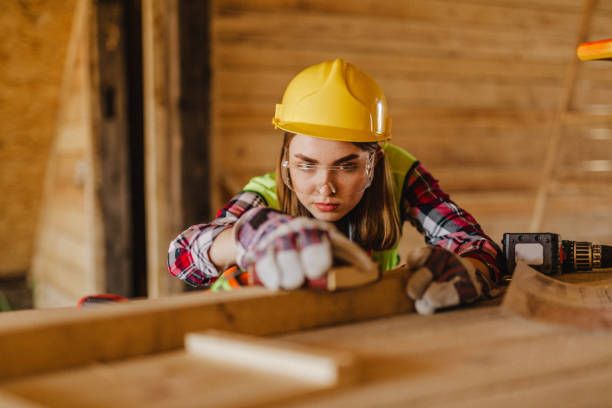 istock Blue-collar woman working on the construction site 1140264047