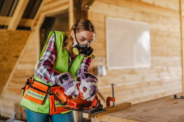 istock Blue-collar woman working on the construction site 1140264305