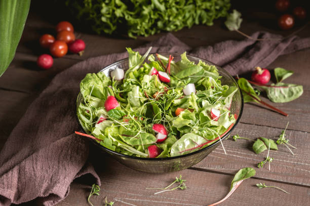 Full bowl of fresh green salad stock photo