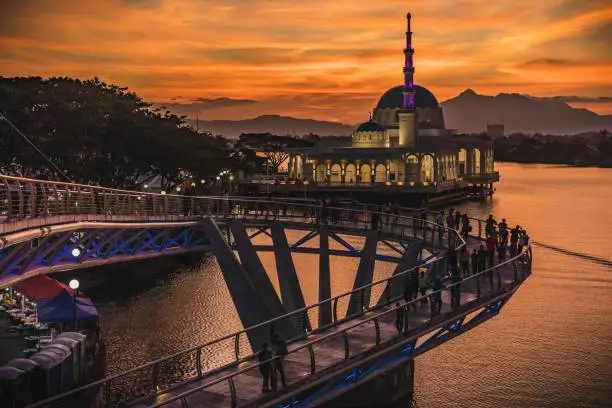 Beautiful view of Kuching landmark, the floating mosque and Darul Hana Bridge at sunset