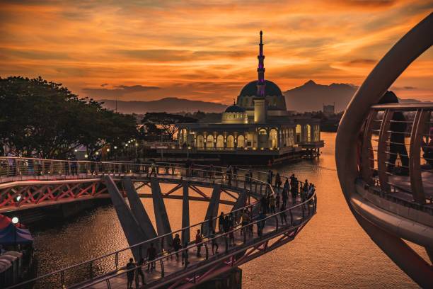 Kuching Floating Mosque and Darul Hana abridge Beautiful view of Kuching landmark, the floating mosque and Darul Hana Bridge at sunset kuching waterfront stock pictures, royalty-free photos & images