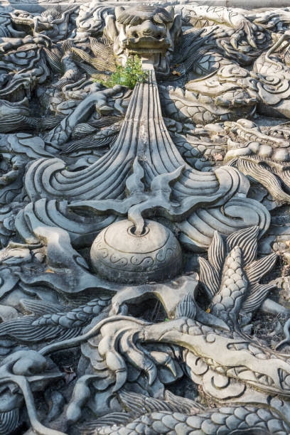 istock Stone dragon bas-relief sculpture in a buddhist temple 1140275435