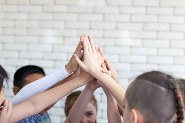 istock Kids hand assemble as a connection meeting teamwork concept. Teamwork conceptual. 1140276763