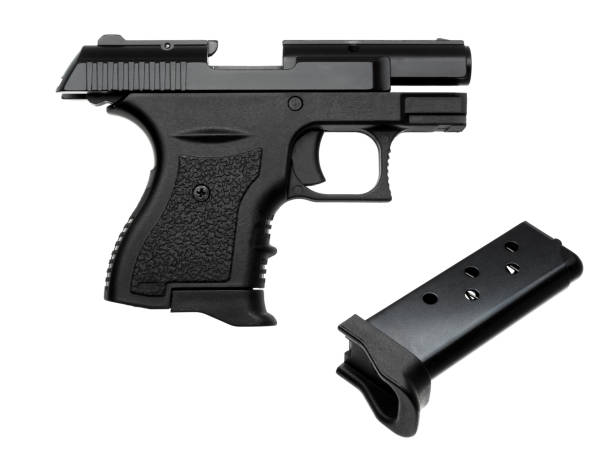 istock black gun pistol isolated on white background 1140279186