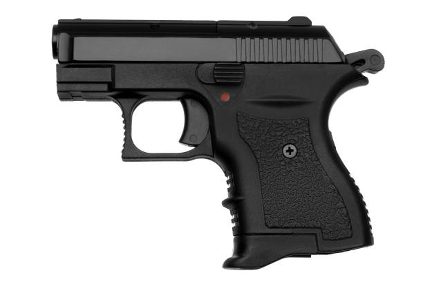 istock black gun pistol isolated on white background 1140279334